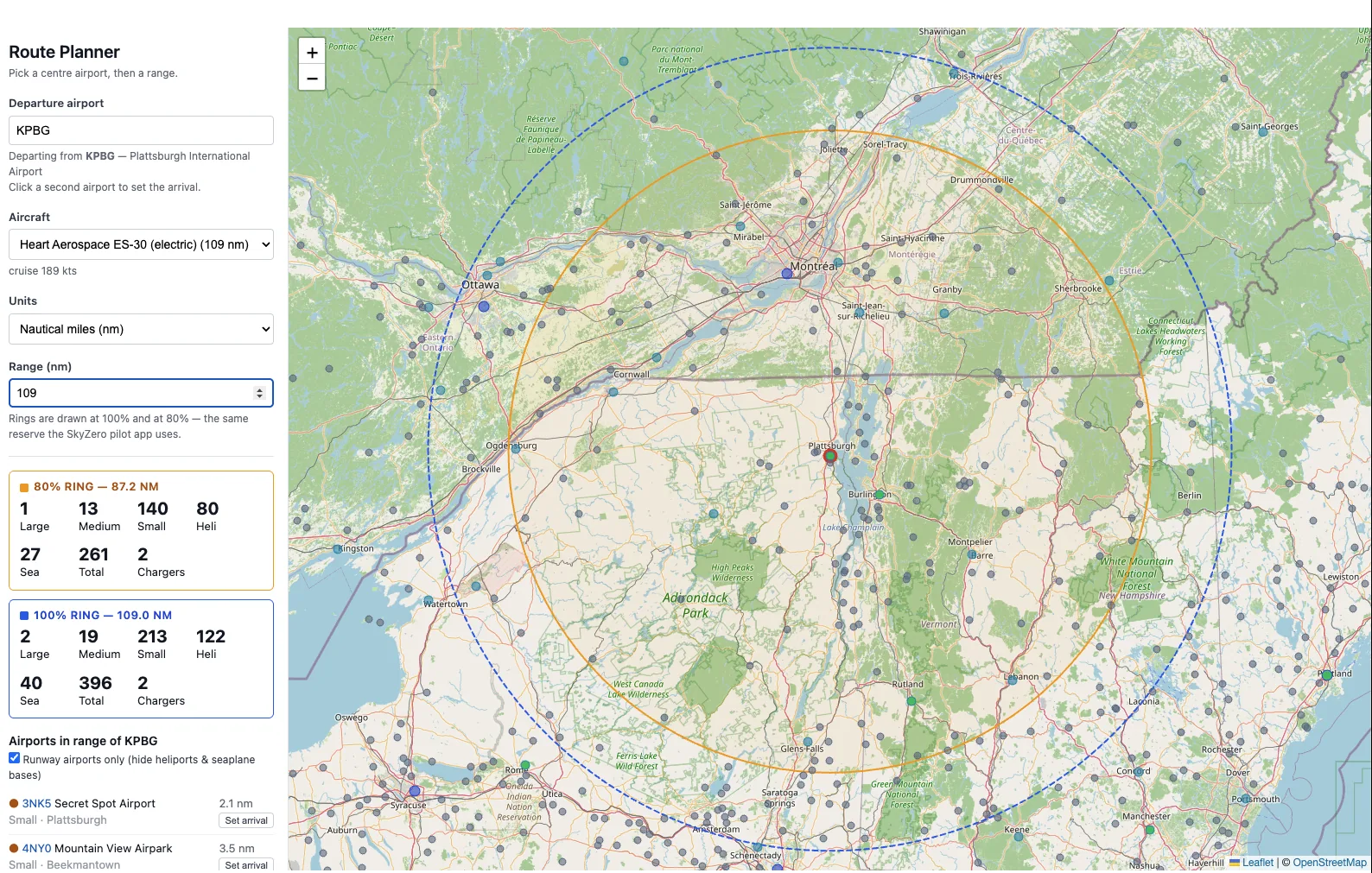 The SkyZero Route Planner showing range rings around Plattsburgh International for a Heart Aerospace ES-30, with reachable airports listed alongside the map.
